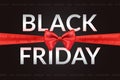 Black friday bow. Header for fridays sale festival, fashion satin red ribbon present gift horizontal seller banner Royalty Free Stock Photo