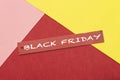 Black friday cardboard paper gift tag isolated on colorful background Royalty Free Stock Photo