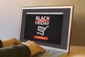 Black friday concept on laptop computer screen on wooden table Royalty Free Stock Photo