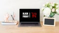 Black Friday concept. Laptop screen with text sign Royalty Free Stock Photo