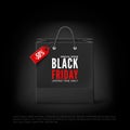 Black Friday concept. Black paper bag with tag Sale and text. Black friday banner template. Vector illustration isolated on black Royalty Free Stock Photo