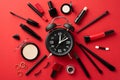 Black friday concept. Top view photo of alarm clock compact powder nail polish mascara false lashes eyeshadow brushes eyebrow gel Royalty Free Stock Photo