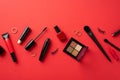 Black friday concept. Top view photo of cosmetics eyeshadow palette nail polish mascara false lashes brushes lipstick and gold