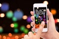 Black friday concept. Woman hand click BUY NOW on mobile with bl Royalty Free Stock Photo