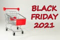 Black Friday 2021. Design for Black Friday accompanied by a metal shopping cart for the huge sales on these dates.