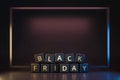 Black friday dice with thanksgiving and christmas concept on dark neon light frame background. Discount and Special offer for sale