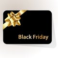 Black friday gift card black with gold bow on a white background. Royalty Free Stock Photo