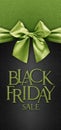 Black friday gift card with shiny green ribbon bow isolated on glittering black background template with black friday sale written
