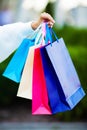 Black friday. Happy woman near shopping mall holding gift bags Royalty Free Stock Photo