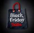 Black Friday lettering and shopping bag banner