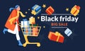 Black friday promotion advertising concept. Young happy girl rolling supermarket trolley full of gifts. Isolated dark background.