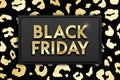 Black Friday Sale banner on glossy golden and black leopard skin texture background. Vector illustration stylish design template Royalty Free Stock Photo