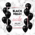 Black friday Sale banner. Shiny black balloons on marble background with rose gold frame. Royalty Free Stock Photo