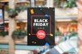 Black friday sale banner in shopping mall. Holiday sale concept