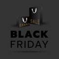 Black Friday sale banner template with black shopping bag objects on dark background. Black and gold text lettering. Royalty Free Stock Photo