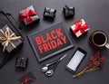 Black Friday sale concept. Black Friday text on black chalkboard with gift boxes, cup of coffee, smartphone. Generative AI Royalty Free Stock Photo