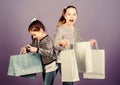 Black friday. Sale and discount. Shopping day. Children bunch packages. Kids fashion. Girls sisters friends with Royalty Free Stock Photo
