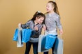 Black friday. Sale and discount. Shopping day. Children hold bunch packages. Kids fashion. Expect more. Pay less. Girls Royalty Free Stock Photo