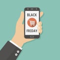 Black friday sale. Hand holding smartphone with Black friday sale on screen. Royalty Free Stock Photo