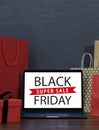 Black Friday sale shopping banner. Mockup of special day, empty black board for logo and text. Isolated black wood texture