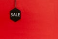 Black friday. Sale tag on the red background Royalty Free Stock Photo