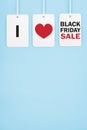 Black friday.Sale tags with text and the rope hanging on blue background Royalty Free Stock Photo