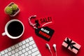 Black Friday Sale text on a red and black tag with coffee cup Royalty Free Stock Photo