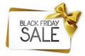 Black Friday sale text write on white gift card with golden ribbon bow Royalty Free Stock Photo