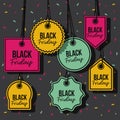 Black friday with set of discount offer tags in yellow magenta and green and pendant of threads in black background with