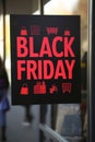 A black friday sign hanging on a store window, AI Royalty Free Stock Photo
