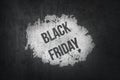 Black Friday sign on white painting and black concrete background. shopping concept