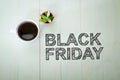 Black Friday text with a cup of coffee Royalty Free Stock Photo