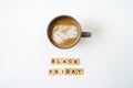 Black friday text on wooden blocks and cup of coffee. top view Royalty Free Stock Photo