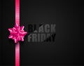 Black Friday vector dark background with pink ribbon bow. Glossy lacquered black text on matt backdrop