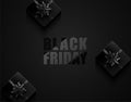 Black Friday vector dark background with black ribbon bow giftbox. Glossy black text on geometric pattern. Gift box on top Royalty Free Stock Photo