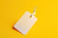 Black Friday. White price tag sticker on a string on a yellow background. AI generated. Royalty Free Stock Photo