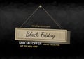 Black Friday wooden signboard hanging in cord