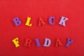 BLACK FRIDAY word on red background composed from colorful abc alphabet block wooden letters, copy space for ad text. Learning Royalty Free Stock Photo