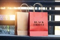 Black friday word on red and brown paper shopping bags Royalty Free Stock Photo