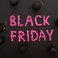 Black Friday words written with neon pink stones