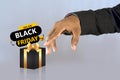Black friday yellow and black decorative sales banner with black gift box