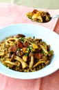 Black fried rice with mushroom and green beans on white platter Royalty Free Stock Photo