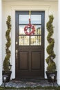 Black front door of home with heart wreath Royalty Free Stock Photo