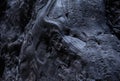 Black frozen lava of the volcano close up