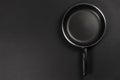 Black fry pan on dark background. top view Royalty Free Stock Photo