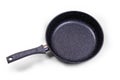 Black frying pan with non-stick coating on a white background. Royalty Free Stock Photo