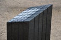 Black gabbro stone prism. it stands in the park and is bevelled and polished. if it gets wet, can play various sound melodies and