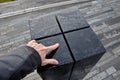 Black gabbro stone prism. it stands in the park and is bevelled and polished. if it gets wet, you can play various sound melodies