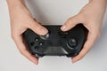 Black game controller in hand