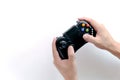 A Black game joystick console controller in gamer hands.Game controller in hand isolated on white background Royalty Free Stock Photo